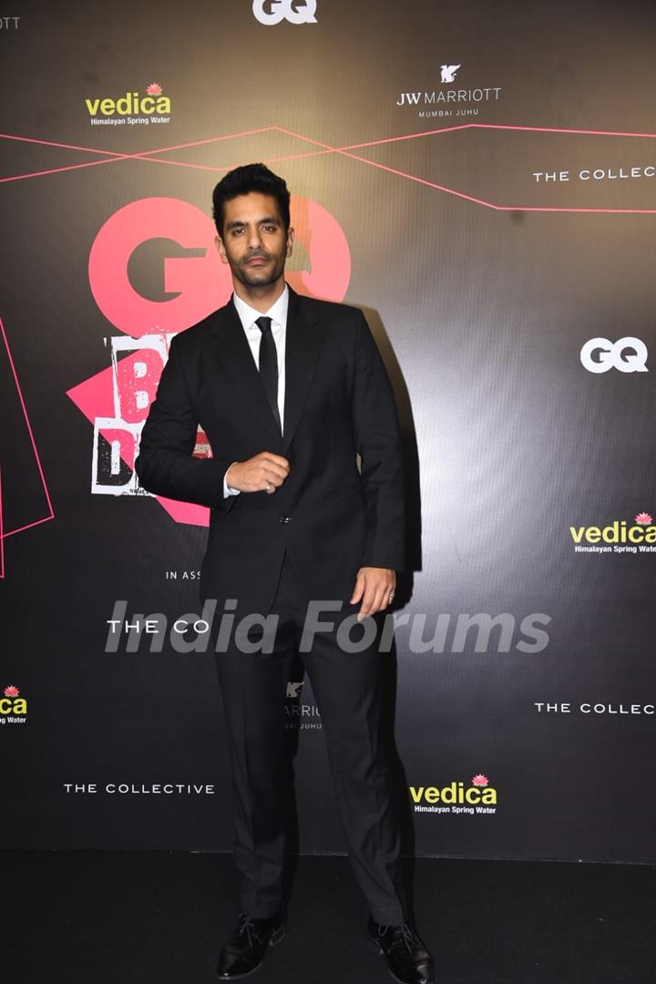 Angad Bedi snapped attending the GQ Best Dressed Awards 2022 in a black and white suit