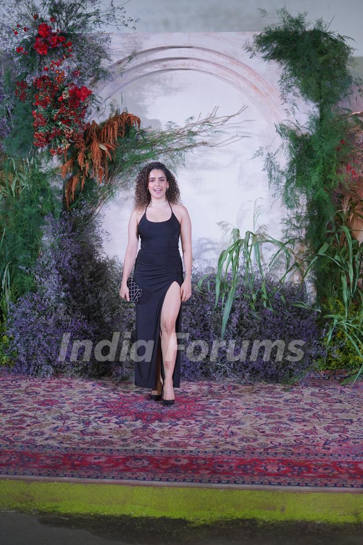 Sanya Malhotra looked sexy in a black, thigh high slit gown at Richa and Ali's wedding reception