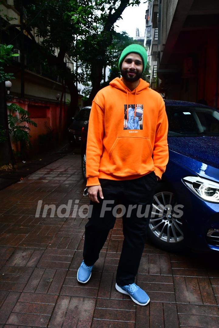 Siddhant Chaturvedi spotted in a city in an orange hoodie and a green beanie