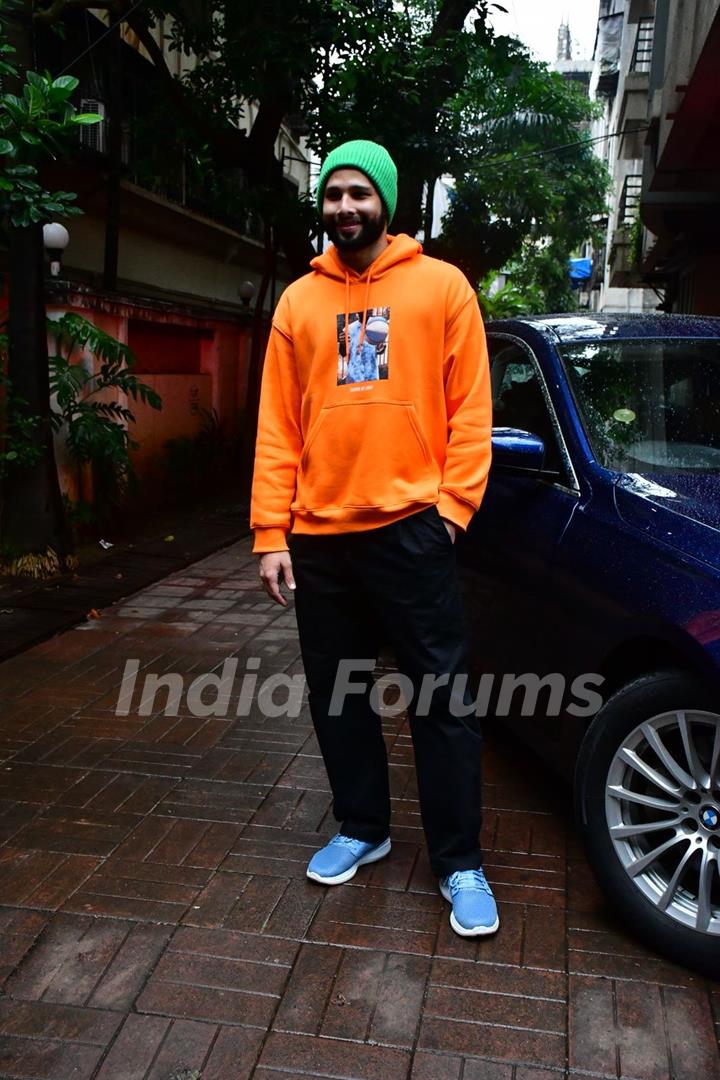 Siddhant Chaturvedi spotted in a city in an orange hoodie and a green beanie