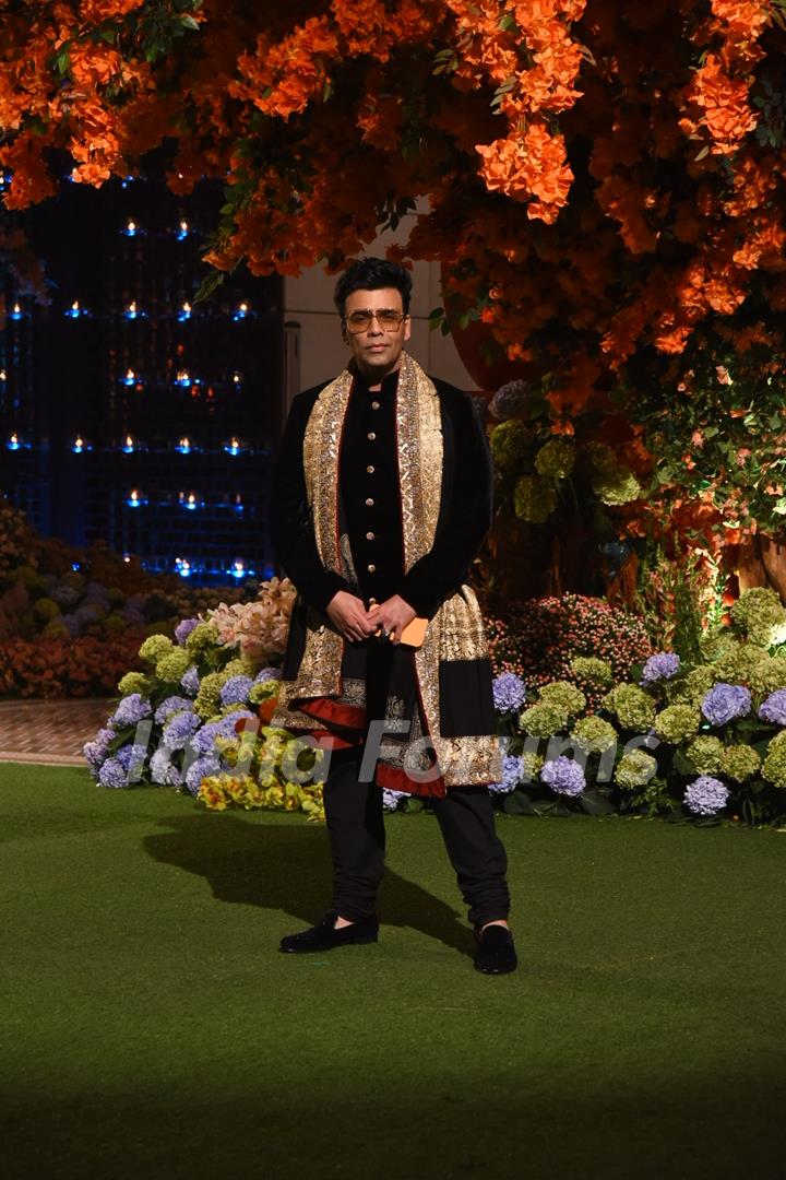 Karan Johar wore a black kurta set paired with a golden shawl. 