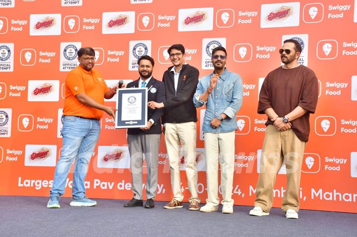 Ajay Devgn and Rohit Shetty attempt the Guinness World Record for the largest Vada Pav delivery at Airport High School & Junior College