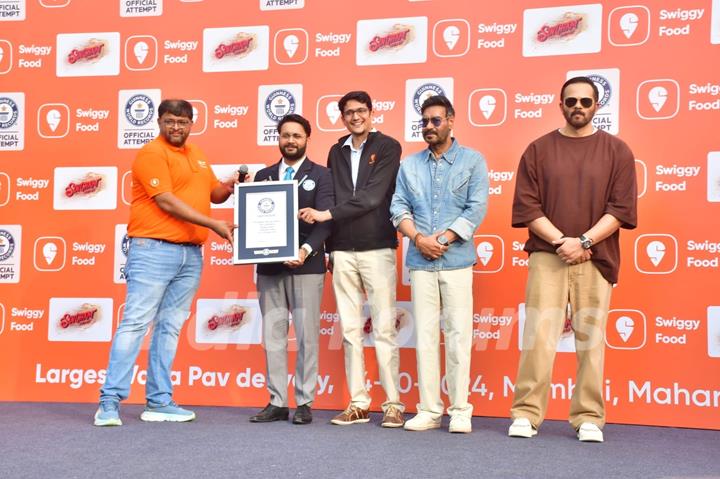 Ajay Devgn and Rohit Shetty attempt the Guinness World Record for the largest Vada Pav delivery at Airport High School & Junior College