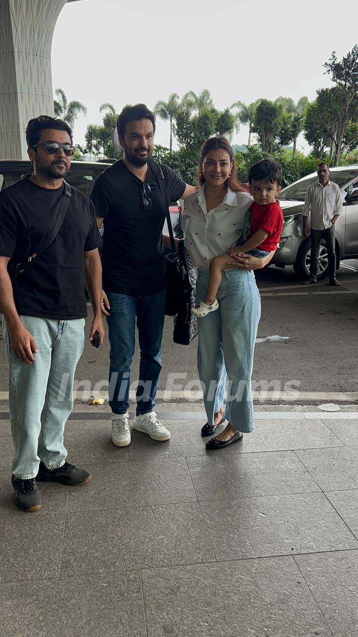 Kajal Aggarwal poses with her family and Surya at the Mumbai airport 