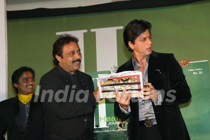 Shah Rukh Khan with Thumbey Moideen at the launch of a health magazine &quot;Health International&quot; in Mumbai on April8