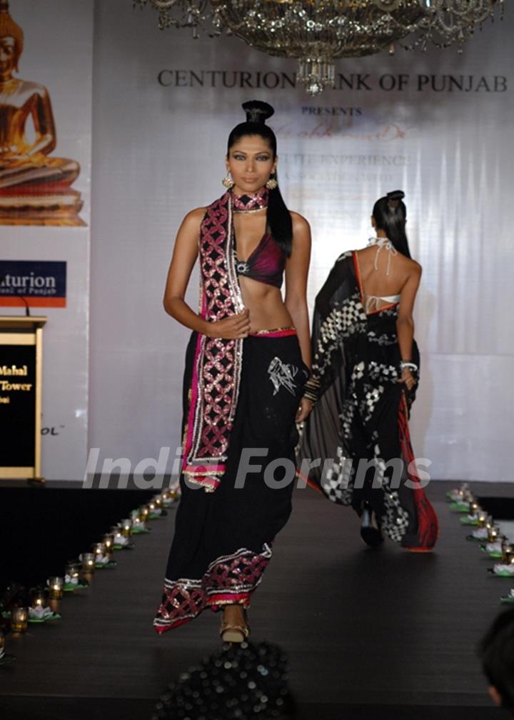 Models show Shobhaa De sarees for Samsaara