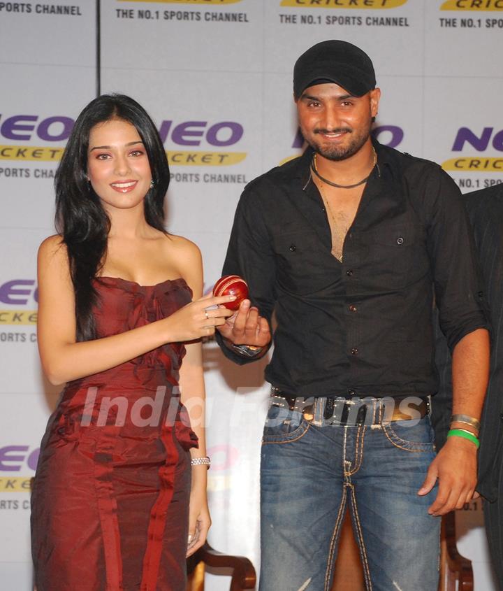 Amrita Rao & Harbhajan Singh pose for pictures at a press conference by Neo Cricket channel to announce the beginning of Cricket season on the channel The season starts from first week of september and continuos till March 2010