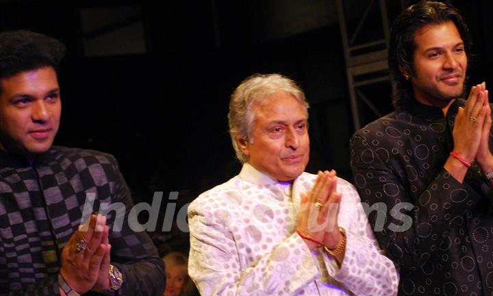 Ustad Amjad Ali Khan and his son Aman Ali Bangash and Ayan Ali Bangas showcases a design by Zubzir Kirmani on the catwalk during the Kolkata Fashion Week in Kolkata on 9th Sept 2009