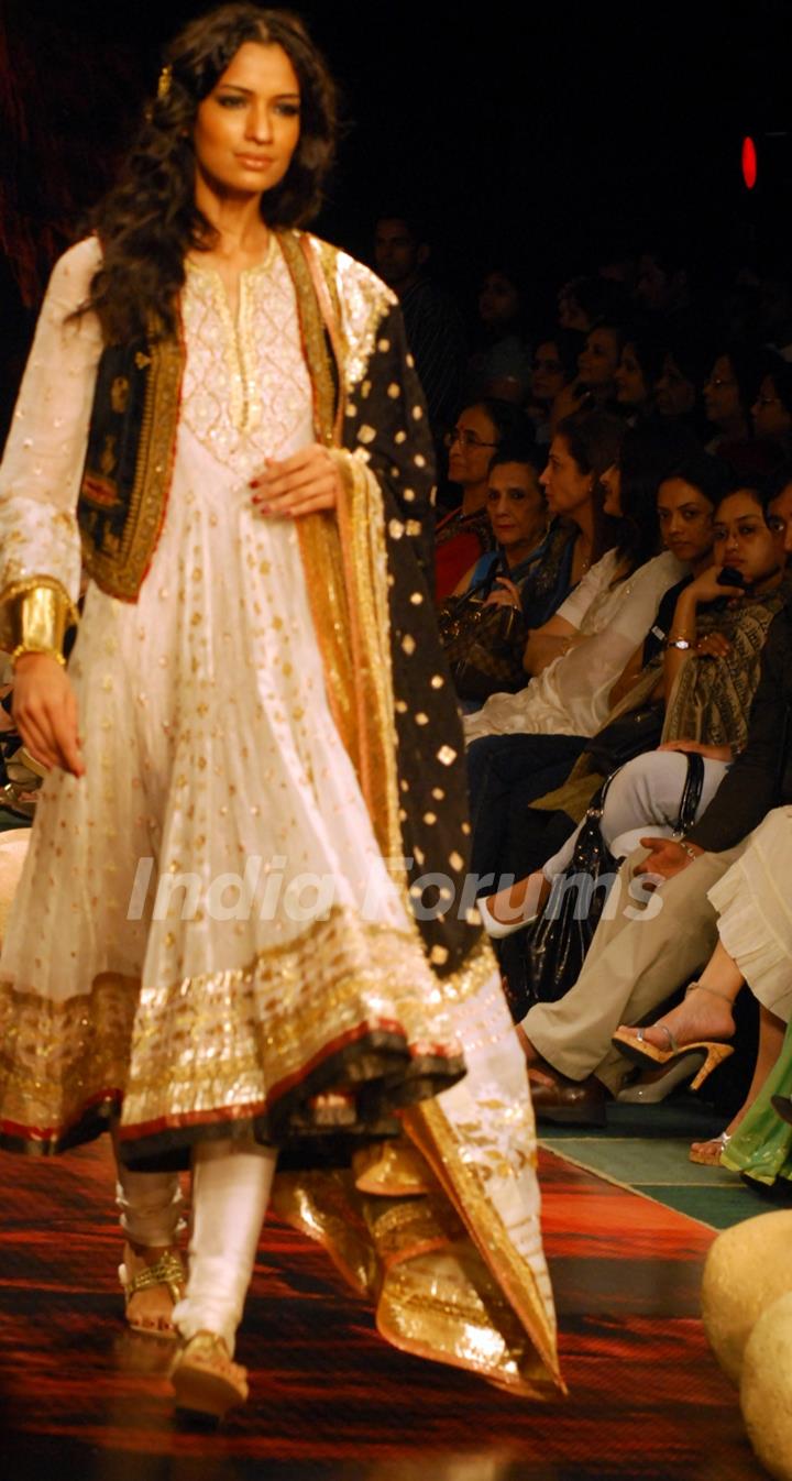 A model showcases a design by Ritu Kumar on the catwalk during the Kolkata Fashion Week in Kolkata on 9th Sep 2009