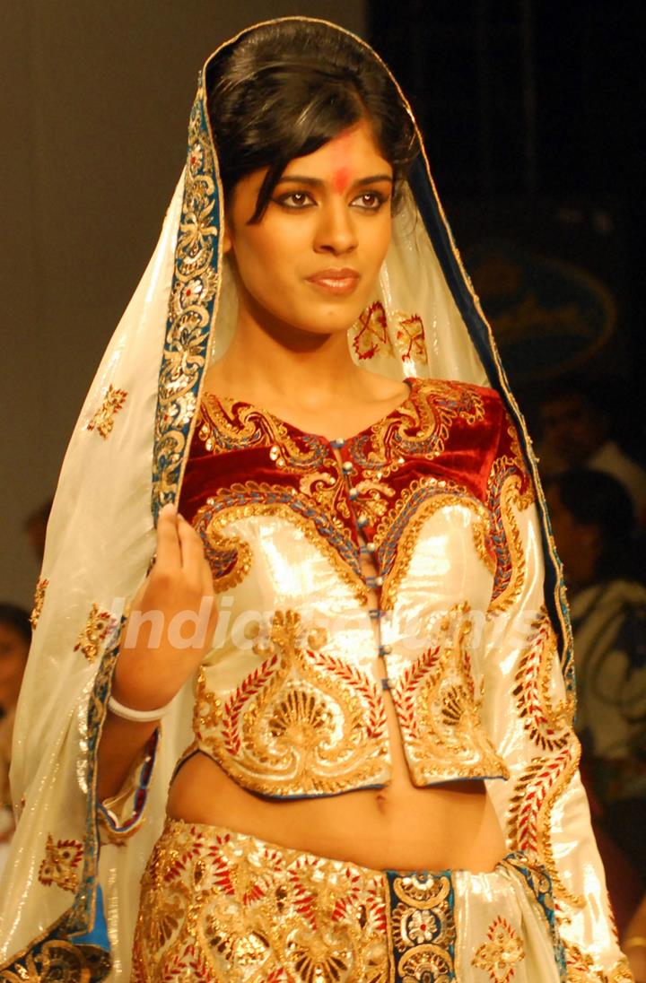 A model catwalks in an outfit design by Kaushik and Pallob during the Kolkata Fashion Week in Kolkata on 10th Sep 2009