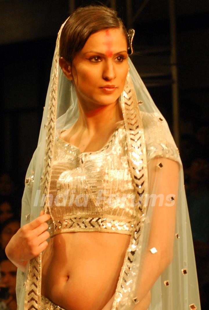 A model catwalks in an outfit design by Abhishek Vyas during the Kolkata Fashion Week in Kolkata on 10th Sep 2009