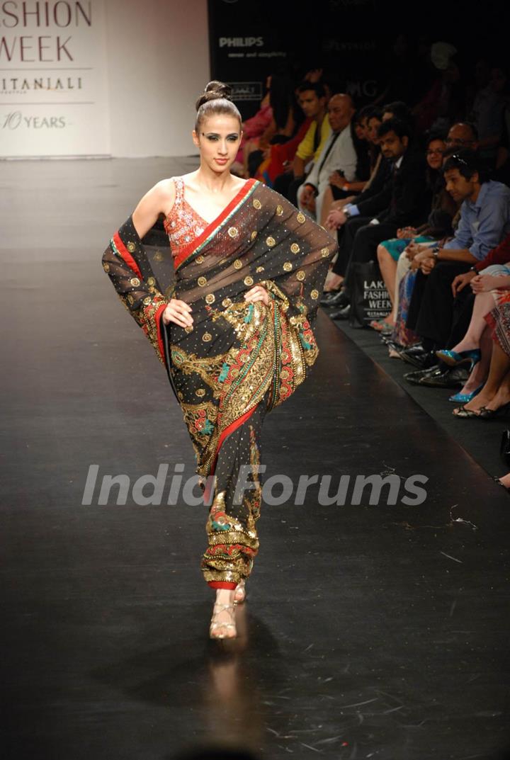 Mode walksl on the ramp of Anita Dongre''s timeless collection for spring/summer 2010 at Lakme Fashion Week was a stylish nostalgic fashion odyssey