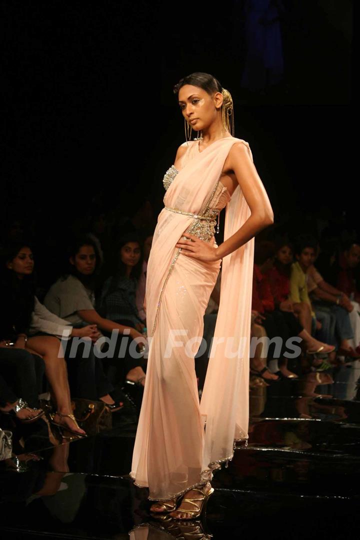 A model walks the runway at Rakesh Aggarwal show at the Lakme Fashion Week Spring/Summer 2010 Day 5, in Mumbai