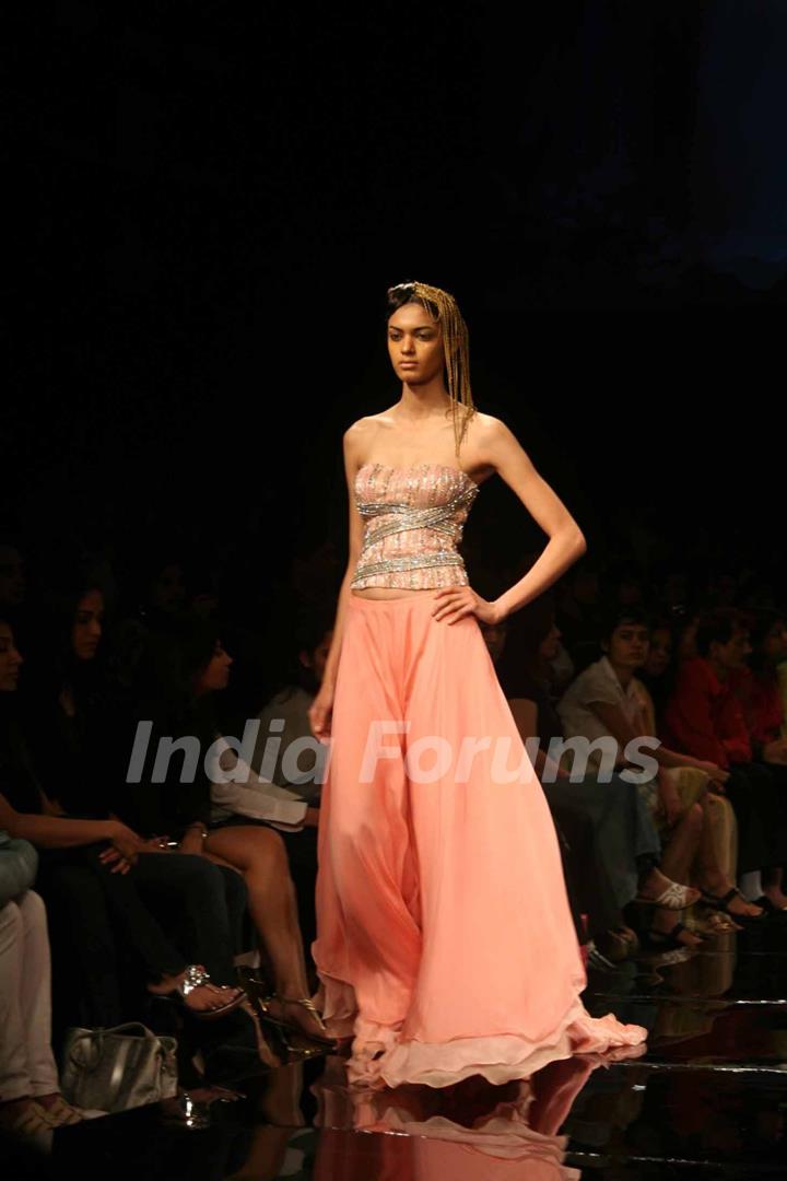 A model walks the runway at Rakesh Aggarwal show at the Lakme Fashion Week Spring/Summer 2010 Day 5, in Mumbai