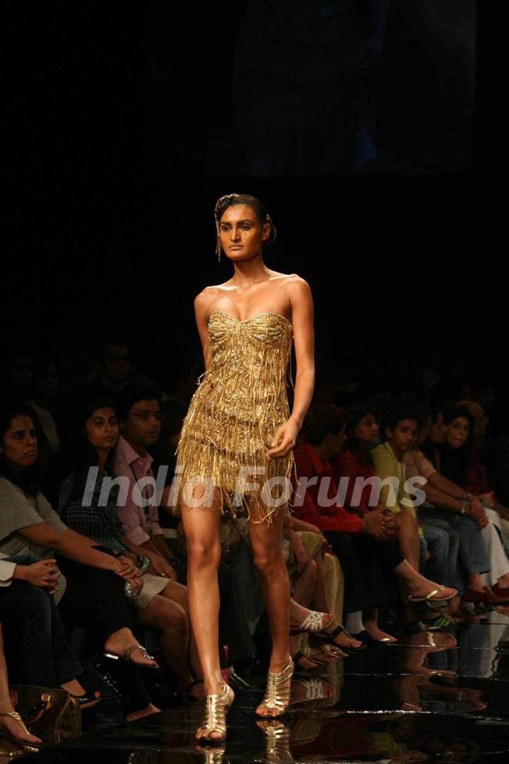 A model walks the runway at Rakesh Aggarwal show at the Lakme Fashion Week Spring/Summer 2010 Day 5, in Mumbai