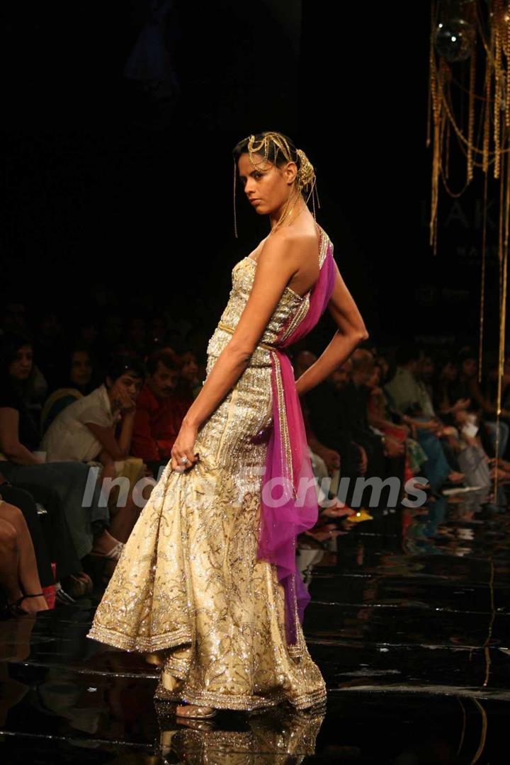 A model walks the runway at Rakesh Aggarwal show at the Lakme Fashion Week Spring/Summer 2010 Day 5, in Mumbai