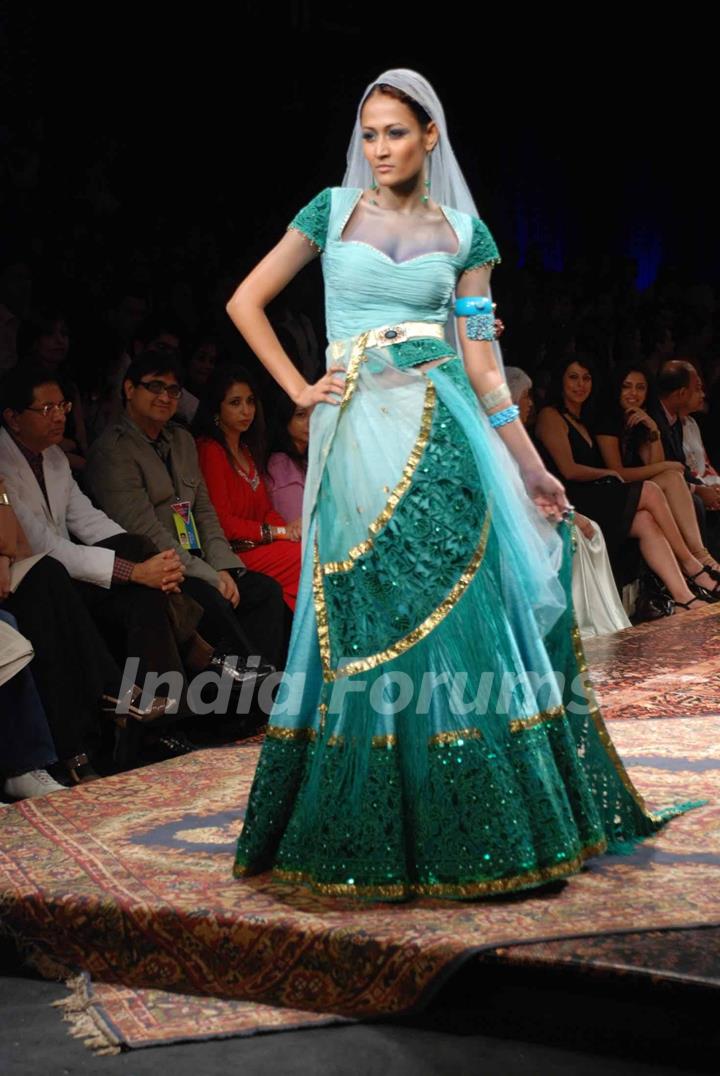 A model walks the runway at Tarun Tahiliani show at the Lakme Fashion Week Spring/Summer 2010 Day 5, in Mumbai