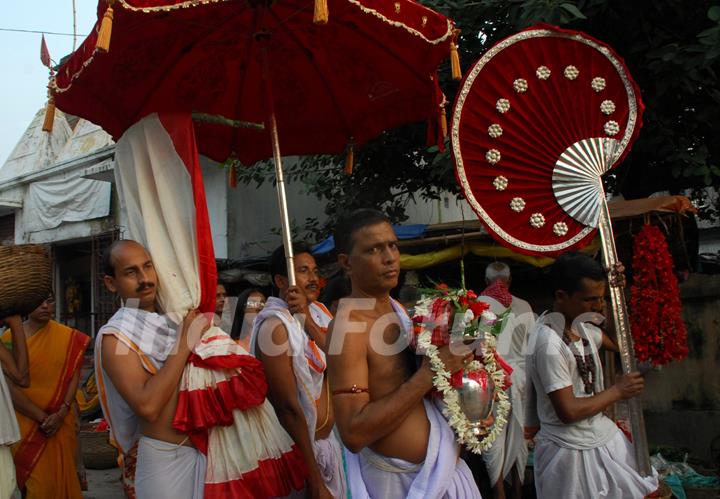 Popularly known as Lord Ganesh''s wife,Kalabou is being taken to the Ghat for bathing which is a popular ritual in Durga puja