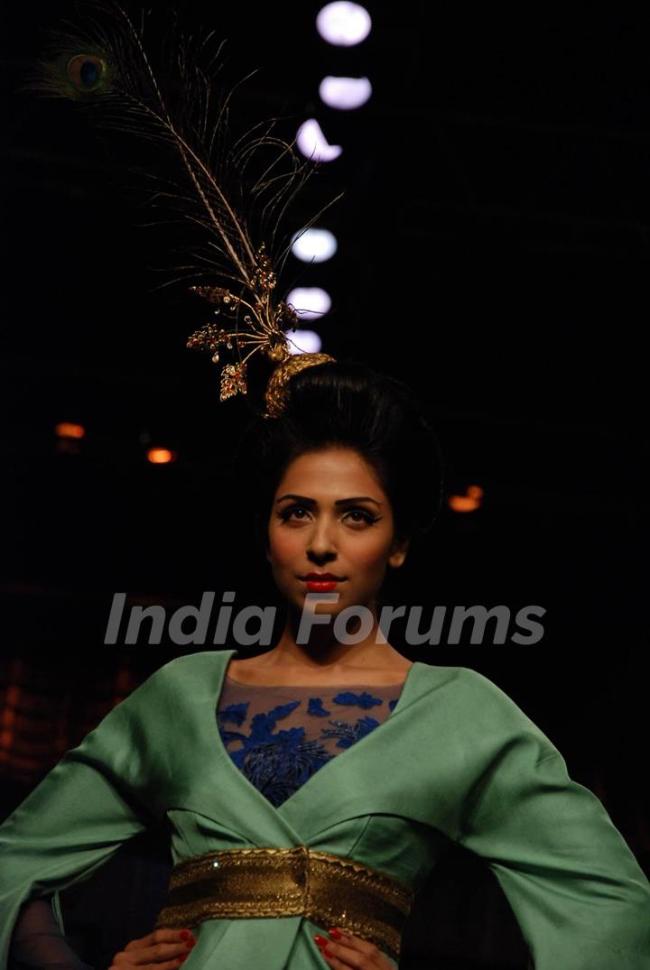 A model showcasing designer Varun Bahl''s creation on the ramp at the HDIL India Couture Week in Mumbai Wednesday night