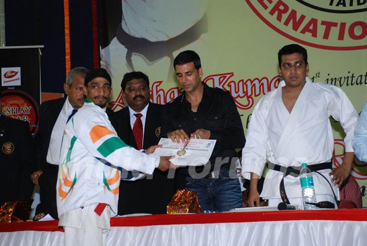 Bollywood Actor Akshay Kumar addresses during 1st Invitational Open National Karate Championship at Andheri Sports Complex, Mumbai on Wednesday, 21 October 2009