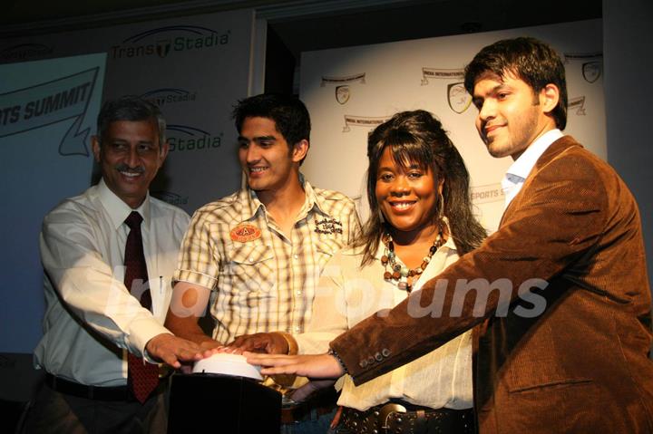 Boxer Vijender Singh signs a boxing glove during the press conference to announce India International Sports Summit in Mumbai on Wednesday,21 October 2009
