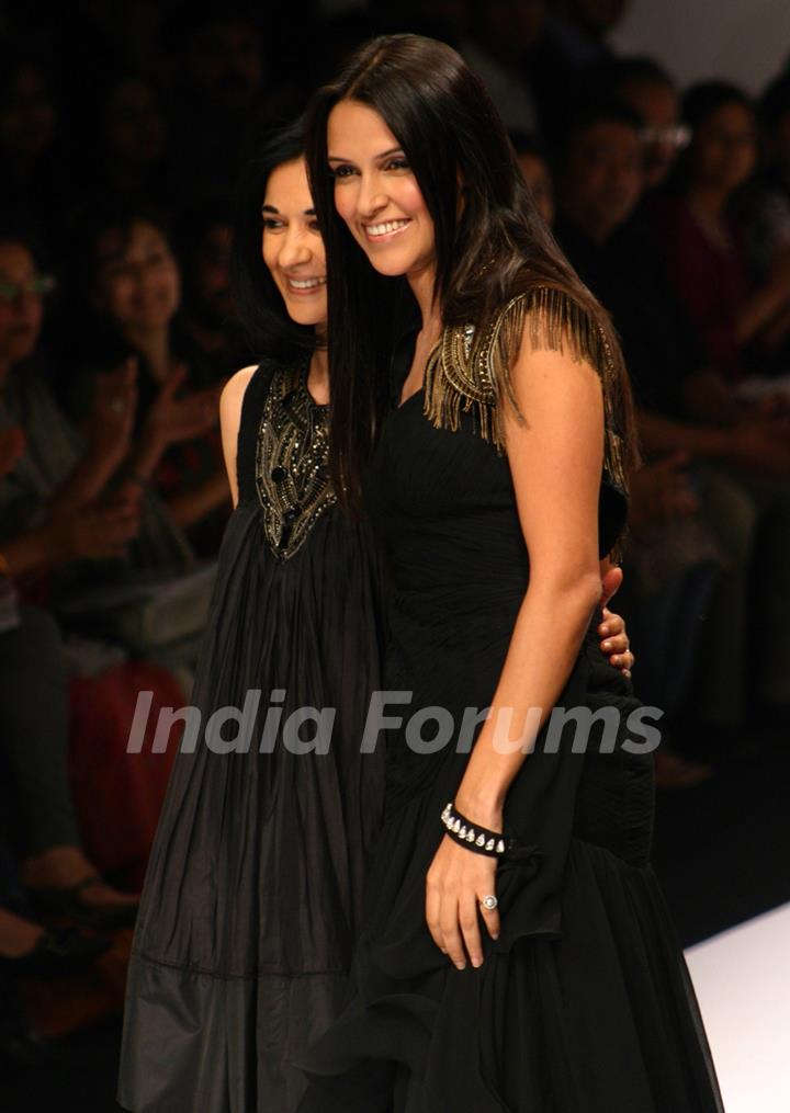 Bollywood actress Neha Dhupia and designer Kavita Bhartia at the Wills Lifestyle India Fashion week in New Delhi on Sunday