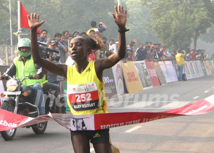 Kenya''s Mary Keitany won the women''s race in the Airtel Delhi Half Marathon , clocking a new record of 66 min:54 sec,in New Delhi on Sunday ( Photo: IANS)