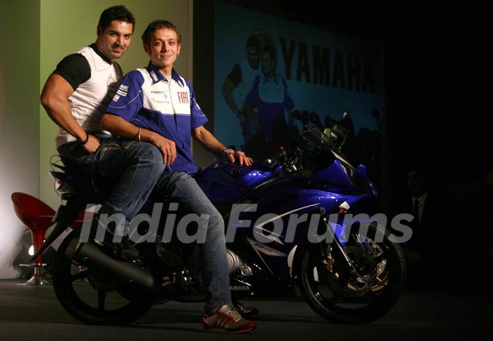 Motogp world champion Valentino Rossi and Bollywood actor John Abraham at a press meet in New Delhi on Sunday