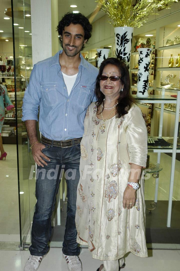Bollywood actor Kunal Kapoor with a guest at the launch of &quot;Tresorie&quot; store in Oberoi Mall
