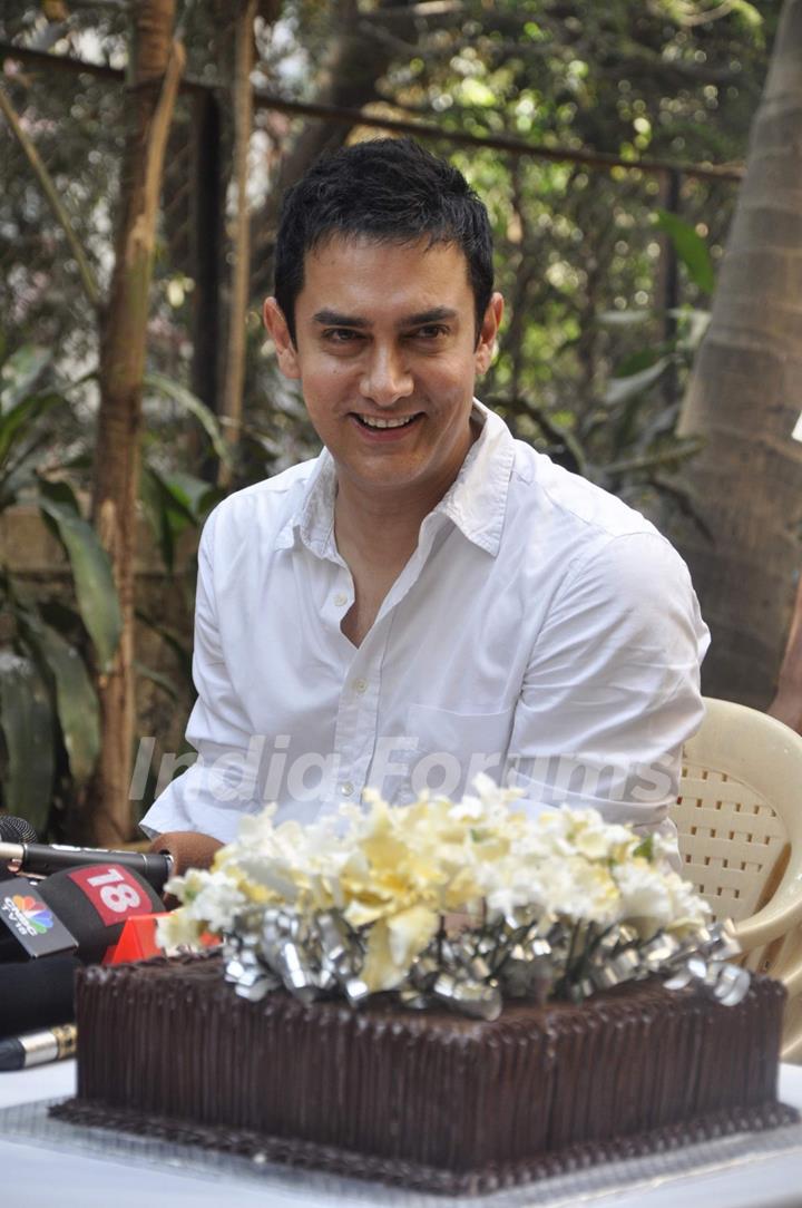 Aamir Khan smiles as he celebrates his 45rd birthday with media today at his home in Mumbai