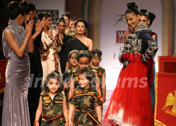 Designer Ritu Beri with models during her show at the Wills Lifestyle India Fashion Week-2010, in New Delhi