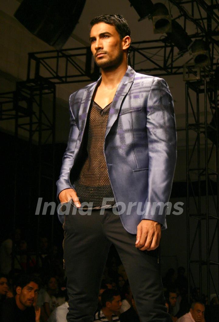 A model showcasing designer Troy Costa''s creations at the Ven Heusen India Mens Week, in New Delhi