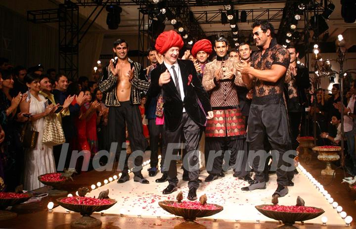 Designer Rohit Bal with Bollywood actor John Abraham  during his show  at the Ven Heusen India Mens Week, in New Delhi