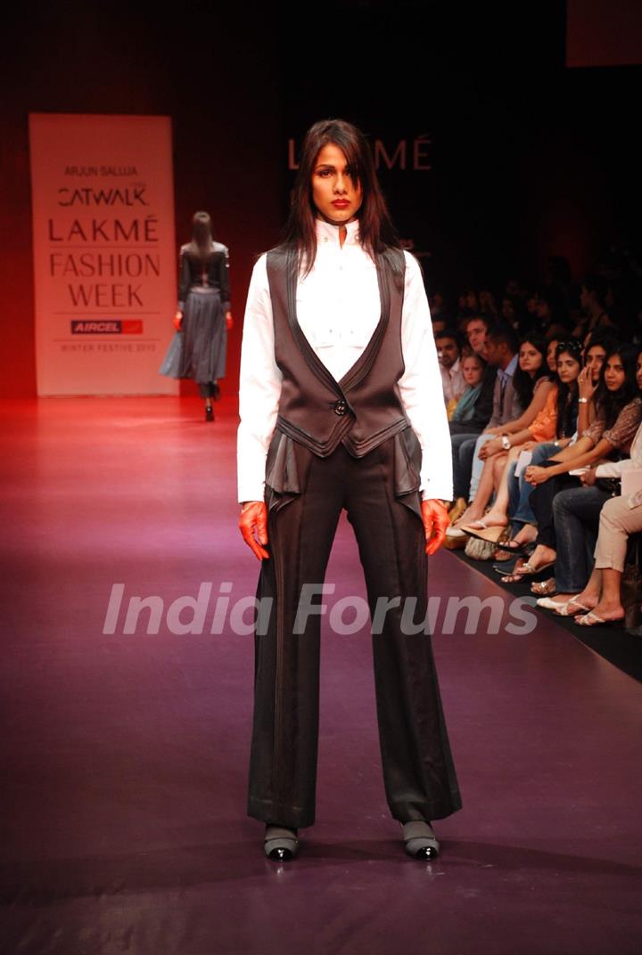 A model walks the runway in an Arjun Saluja design at the Lakme Fashion Week