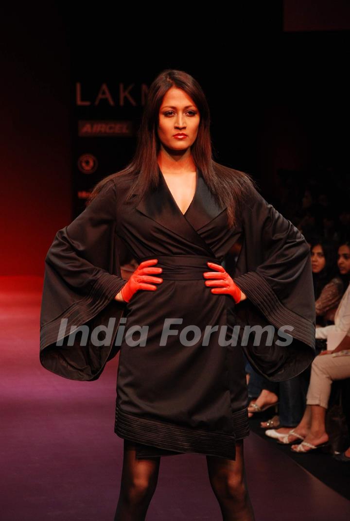 A model walks the runway in an Arjun Saluja design at the Lakme Fashion Week
