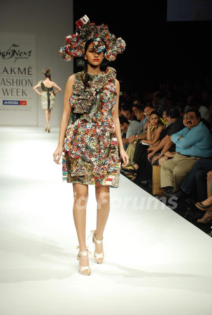 A model walks the runway in an Gen Next design at the Lakme Fashion Week