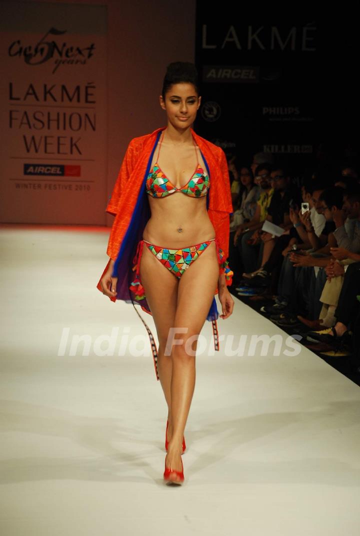A model walks the runway in an Gen Next design at the Lakme Fashion Week