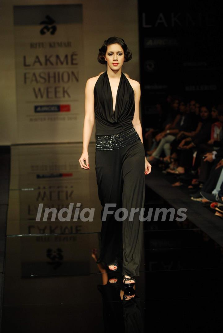 A model walks the runway in an Ritu Kumar design at the Lakme Fashion Week