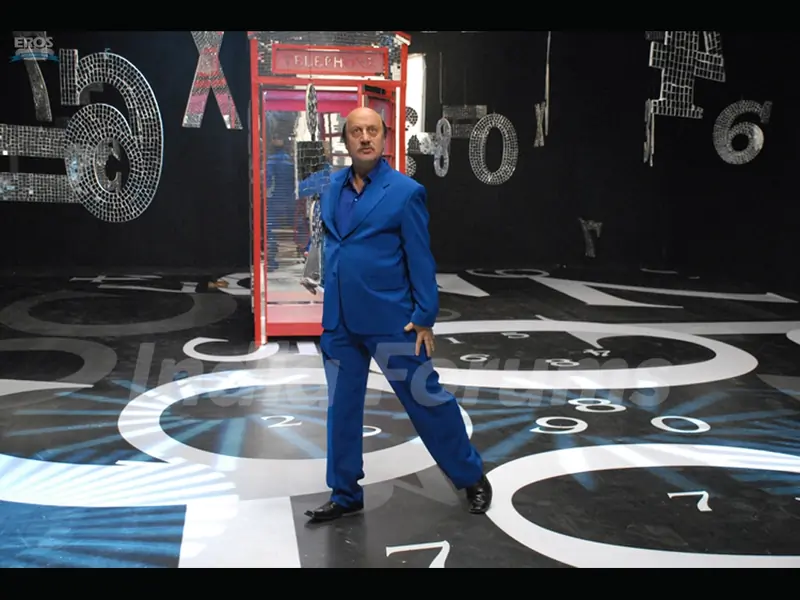 Anupam Kher standing on the stage