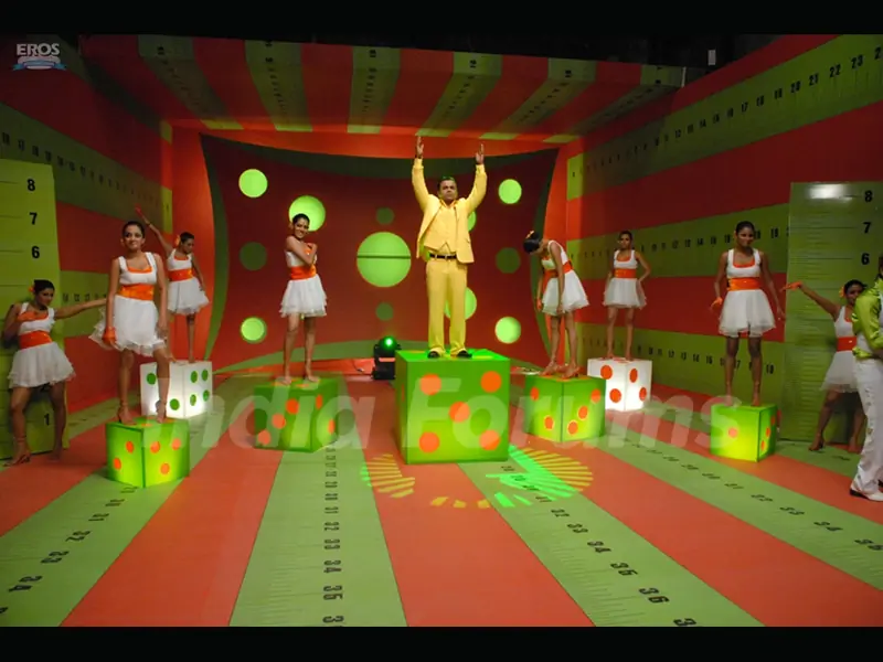 Rajpal Yadav standing on a dice