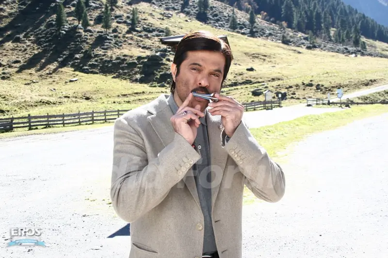 Anil Kapoor playing a harmonica