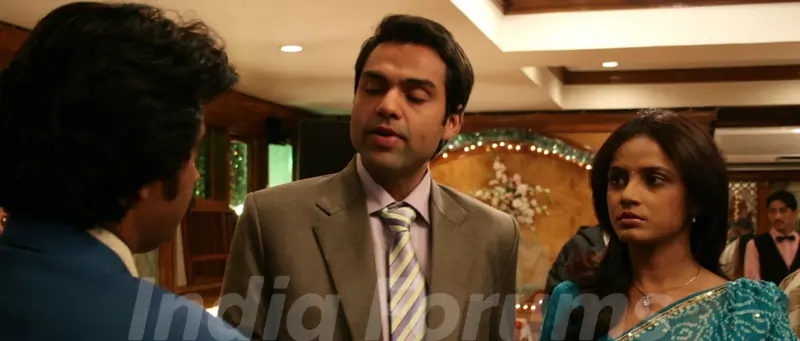 Abhay Deol and Neetu Chandra talking to a man