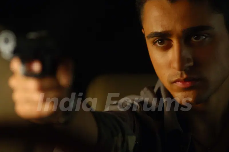 Imraan Khan with a rifle