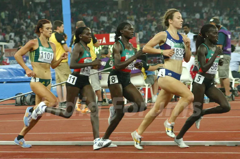 Gold medalist Vivian Cheruiyot of Kenya (1st from R)  Silver medalist Sylvia Kibet of Kenya (4th from R) and Bronze medalist Ines Chenonge of Kenya (3rd from R) during  the women's 5000 metres final at the 19th Commonwealth Games, in New Delhi