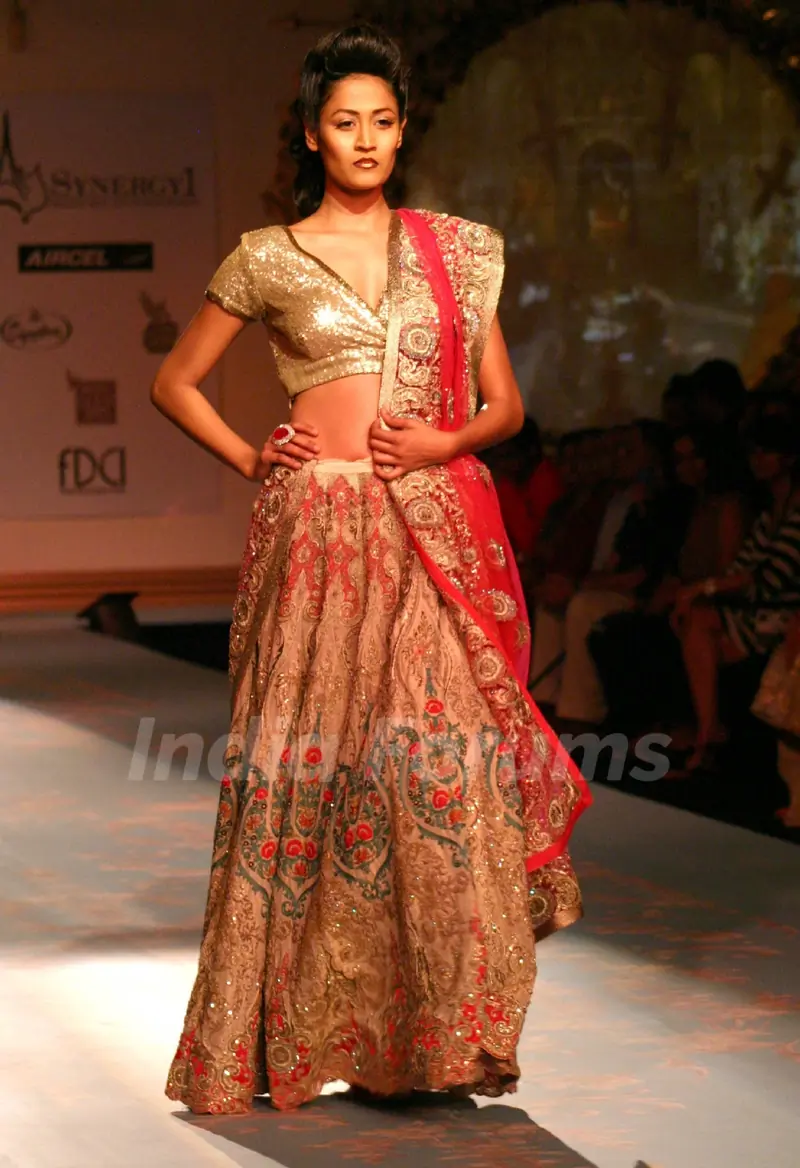 Model walks the ramp for designer Varun Bhal's creation at the Synergy one Delhi Couture Week