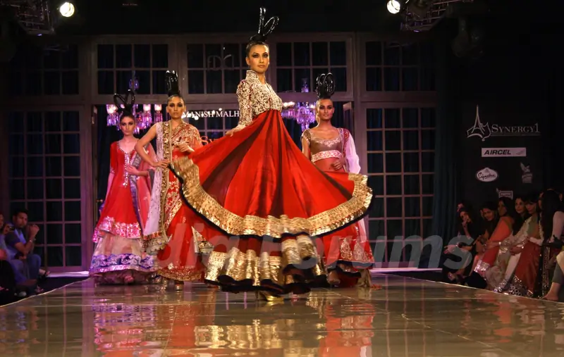 Models showcasing designer Manish Malhotra's creations at Synergy1 Delhi Couture Week,in New Delhi