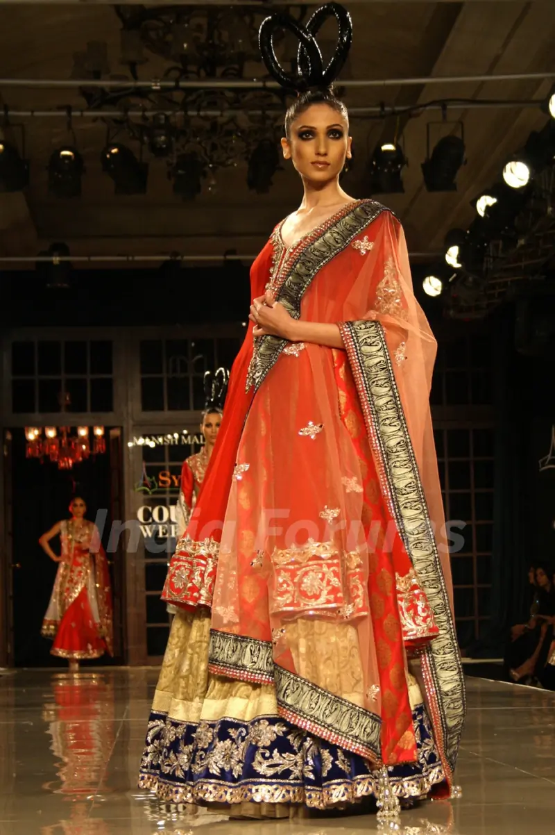Model showcasing designer Manish Malhotra's creations at Synergy1 Delhi Couture Week,in New Delhi