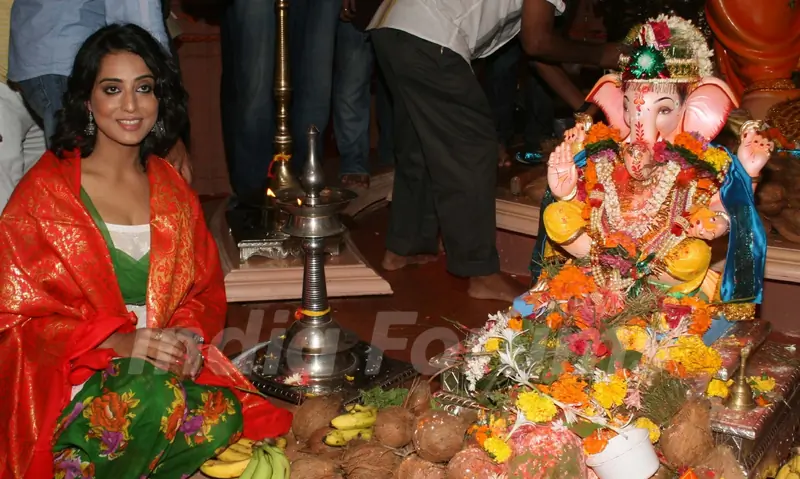 Mahie Gill paying devote to Lord Ganesha during the occasion of Ganesh Chaturthi at their home