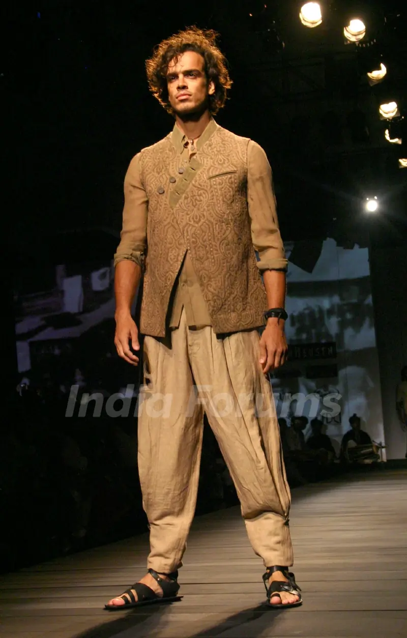 A model showcasing designer Tarun Tahiliani's creation at the Ven Heusen India Mens Week 2011, in New Delhi on Friday. .