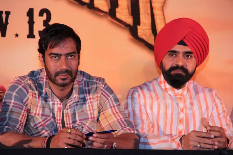 Bollywood actor Ajay Devgan and Congress leader Charan Singh Sapra at Son Of Sardaar press meet to resolve issues with Sikh Community leaders at Hotel Novotel in Juhu, Mumbai.